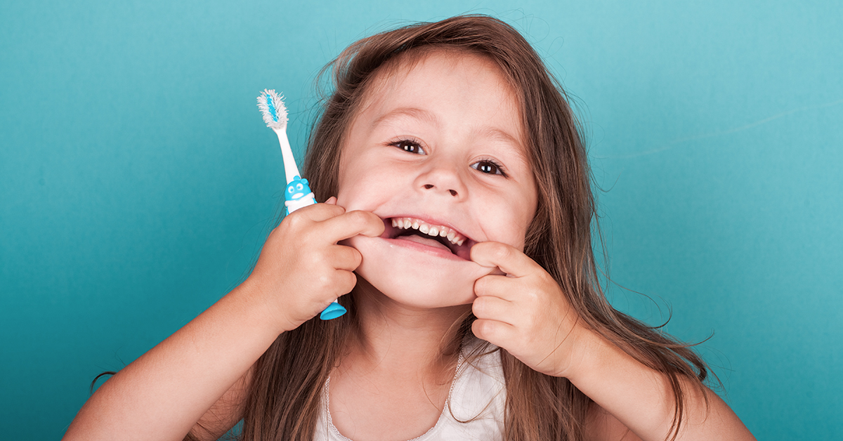 child caring for gums
